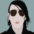 icomania:A man with long black hair and black sunglasses.