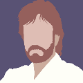 icomania:Man with brown shaggy beard and white shirt.