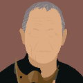 icomania:A man with grey hair and black shirt holding a brown mask