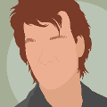 icomania:A man wearing a black shirt with brown wavy hair