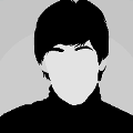 icomania:A Beatles member wearing a black turtleneck with short black hair.