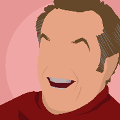 icomania:A man laughing wearing a red turtleneck.