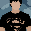 icomania:A man wearing a black Superman shirt.