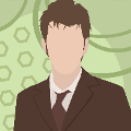 icomania:A man with brown hair and a brown suit and tie in front of a green background.